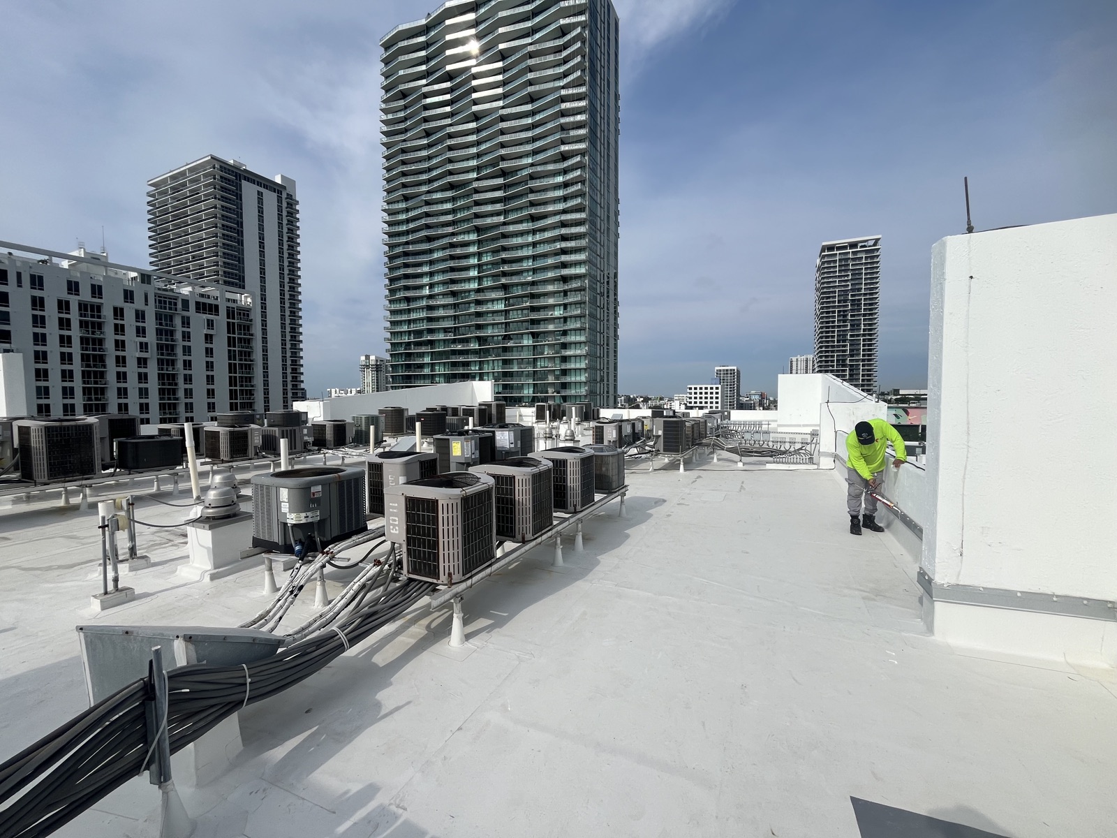 Rooftop AC units with Miami high-rise skyline