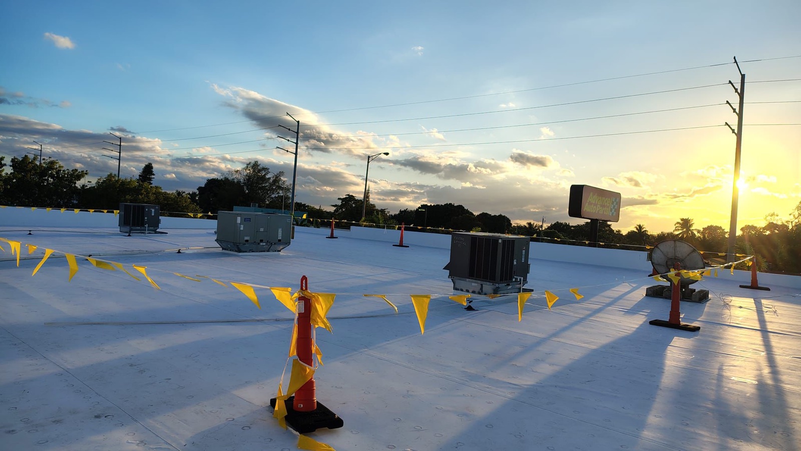 Completed commercial TPO roof at golden hour
