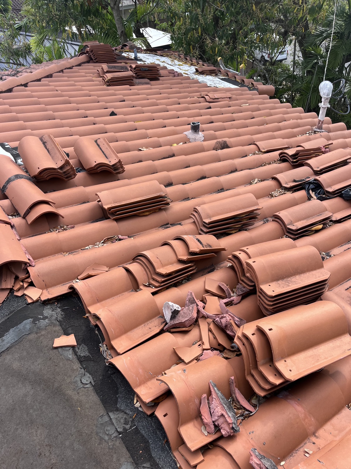 Stacked clay roof tiles ready for installation